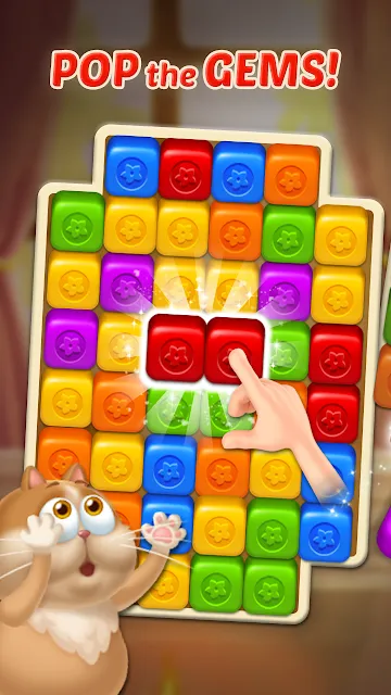 A finger tapping a group of red blocks on a coloured grid